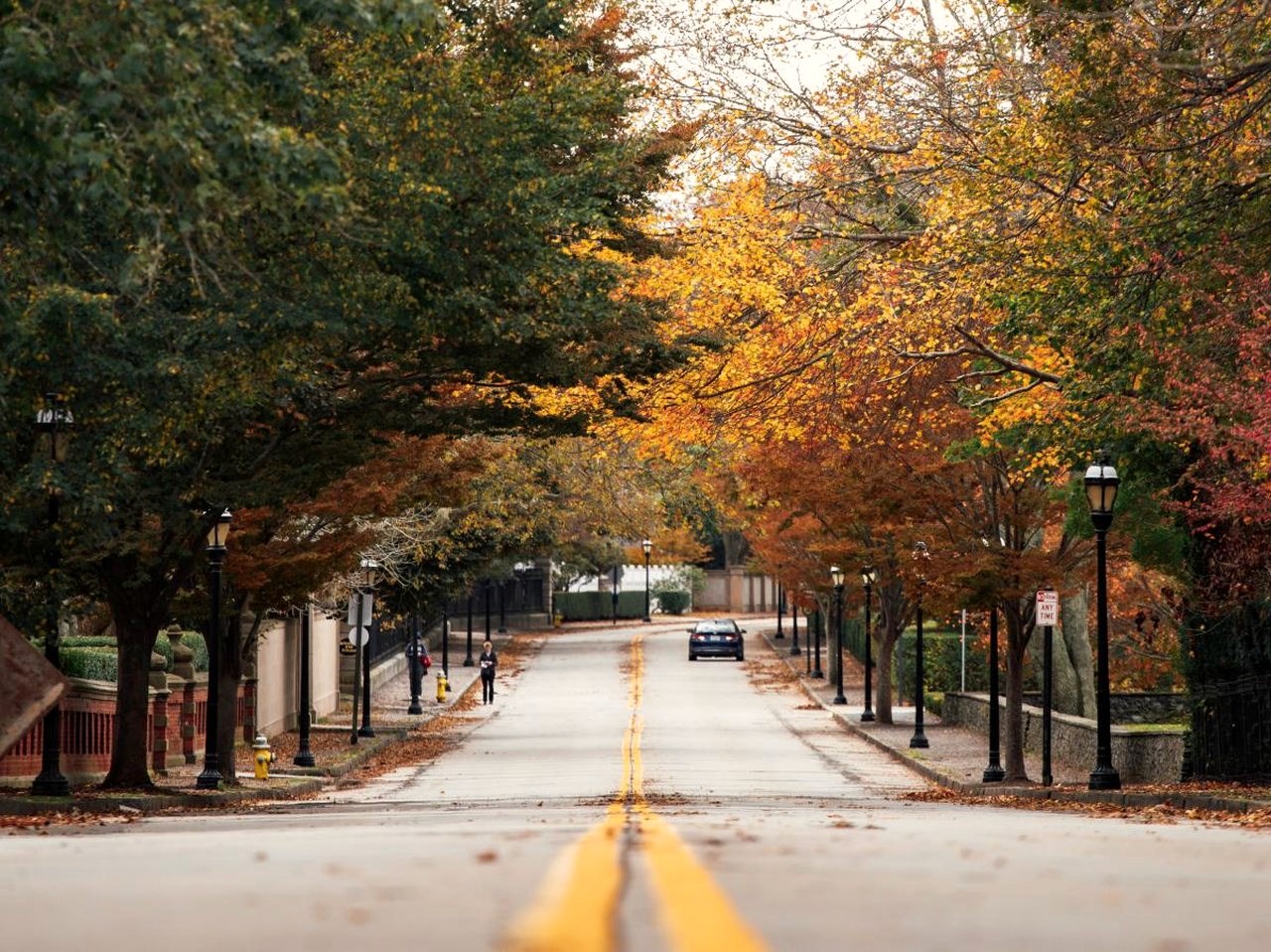 A tree-lined Rhode Island street in autumn